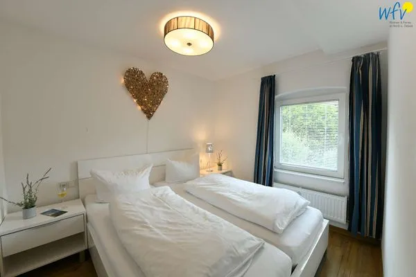 Schlafzimmer Haus Inselrose Ferienwohnung Sandröschen