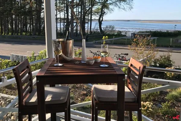 Balkon mit Blick auf das Wattenmeer Haus *Weiße Düne* Ferienwohnung *Weiße Düne 3 / OceanView*