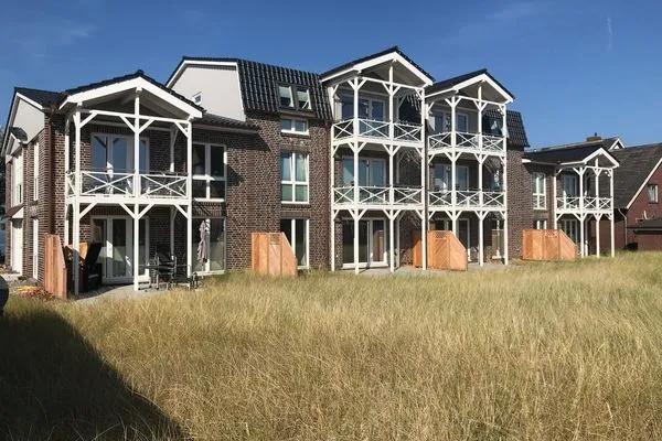 Haus Rückseite Haus *Weiße Düne* Ferienwohnung *Weiße Düne 3 / OceanView*