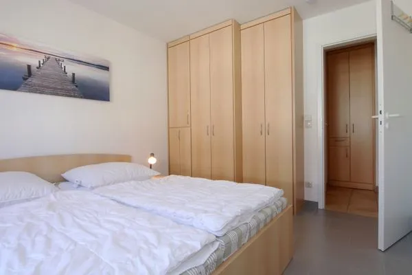Schlafzimmer mit Doppelbett Residenz am Strand Wohnung 4-59