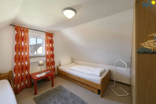 Schlafzimmer Familienhaus im Dorfgroden 27 Ferienwohnung Kompass