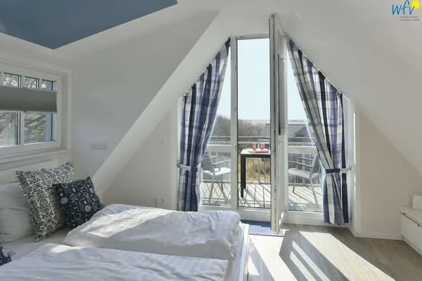 Schlafzimmer Bootshaus in den Dünen - 5 Ferienwohnung 4