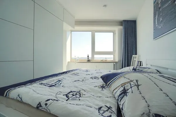 Schlafzimmer  Ferienwohnung Schleiloge mit Panoramablick auf die Schlei