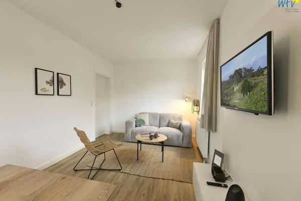 Wohnzimmer Haus am Dorfbrunnen Ferienwohnung Muschel