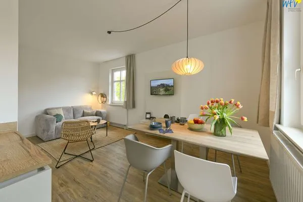 Wohnzimmer Haus am Dorfbrunnen Ferienwohnung Muschel