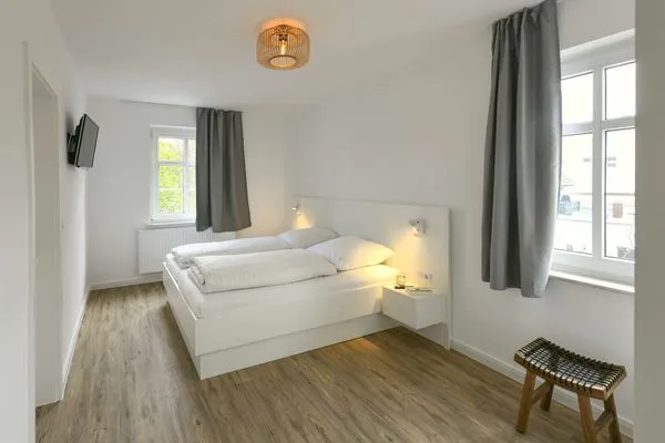 Schlafzimmer Haus am Dorfbrunnen Ferienwohnung Muschel