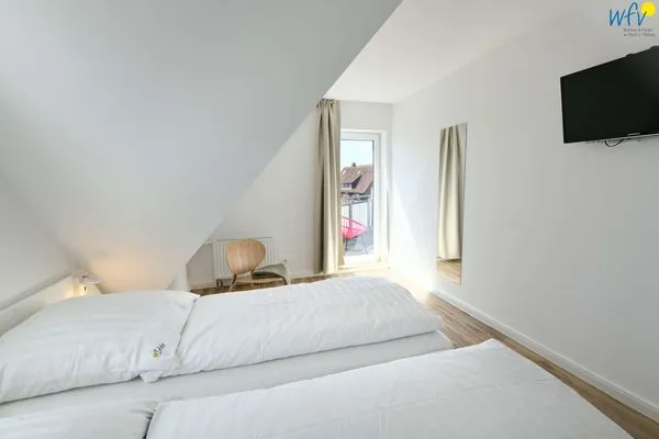 Schlafzimmer Haus am Dorfbrunnen Ferienwohnung Düne