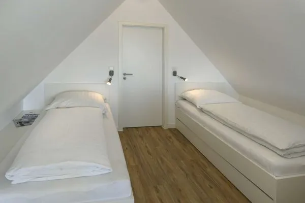 Schlafzimmer Haus am Dorfbrunnen Ferienwohnung Düne