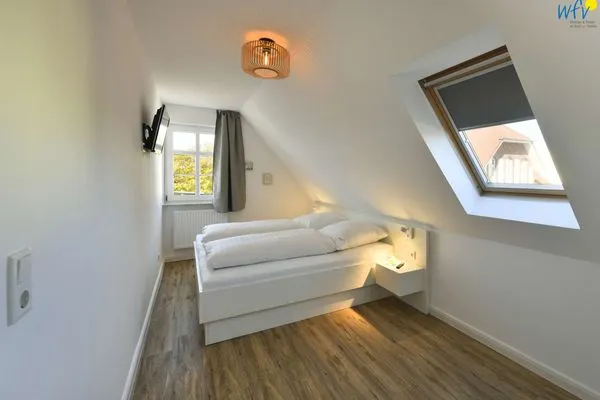 Schlafzimmer Haus am Dorfbrunnen Ferienwohnung Meer