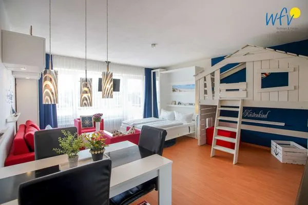 Wohnzimmer Holiday Residenz I Ferienwohnung Küstenkind