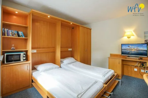 Schlafmöglichkeiten im Wohnzimmer Appartement-Haus Regina Ferienwohnung 6