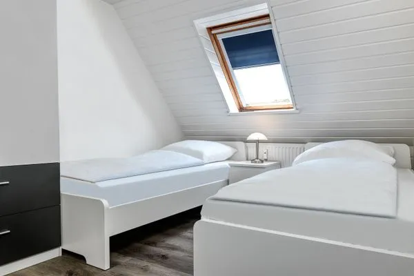 Schlafzimmer Ferienanlage Pfeiffer Haus Strandrose