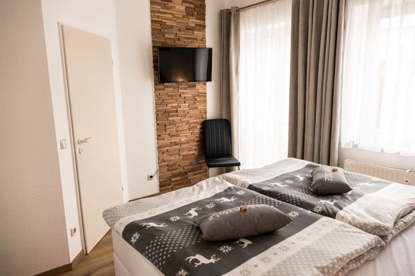 Ferienanlage Neuschwansteinblick Ferienwohnung 101 Ferienwohnungen in Füssen - Bett