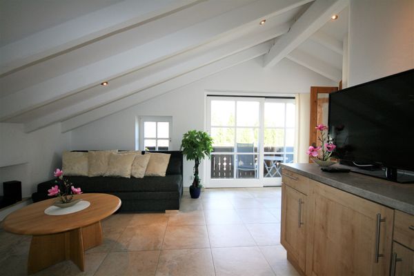  Ferienwohnung Neuschwanstein Ferienwohnungen in Hopfen am See - Wohnzimmer