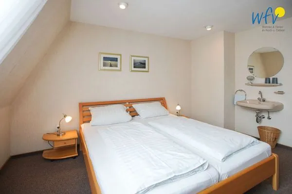 Schlafzimmer Haus Bonhuis Ferienwohnung Leuchtturmblick