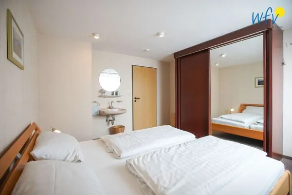 Schlafzimmer Haus Bonhuis Ferienwohnung Leuchtturmblick