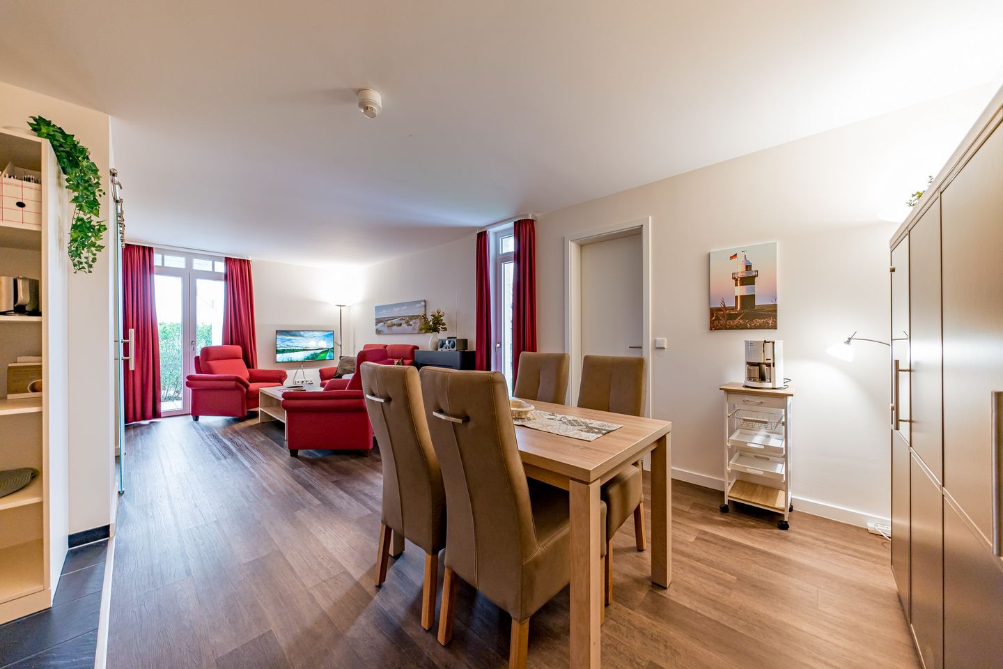 Resort Deichgraf Resort Deichgraf 27-05 Wremen - Wohn-/Essbereich mit Sitzgelegenheit