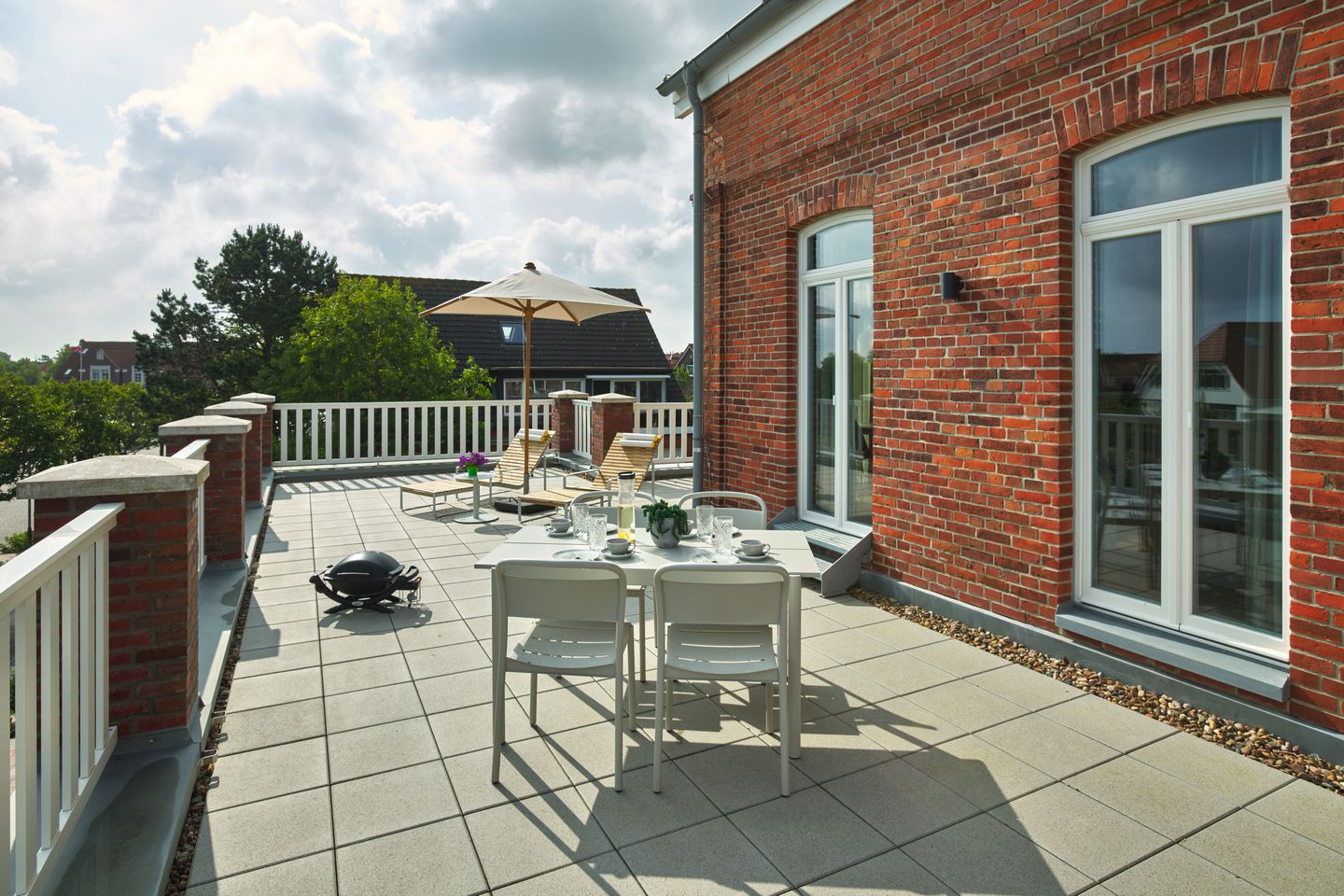 Lüttjeod Apartmentvilla Lüttjeod Apartmentvilla 08 Langeoog - Balkon mit Gartenmöbeln