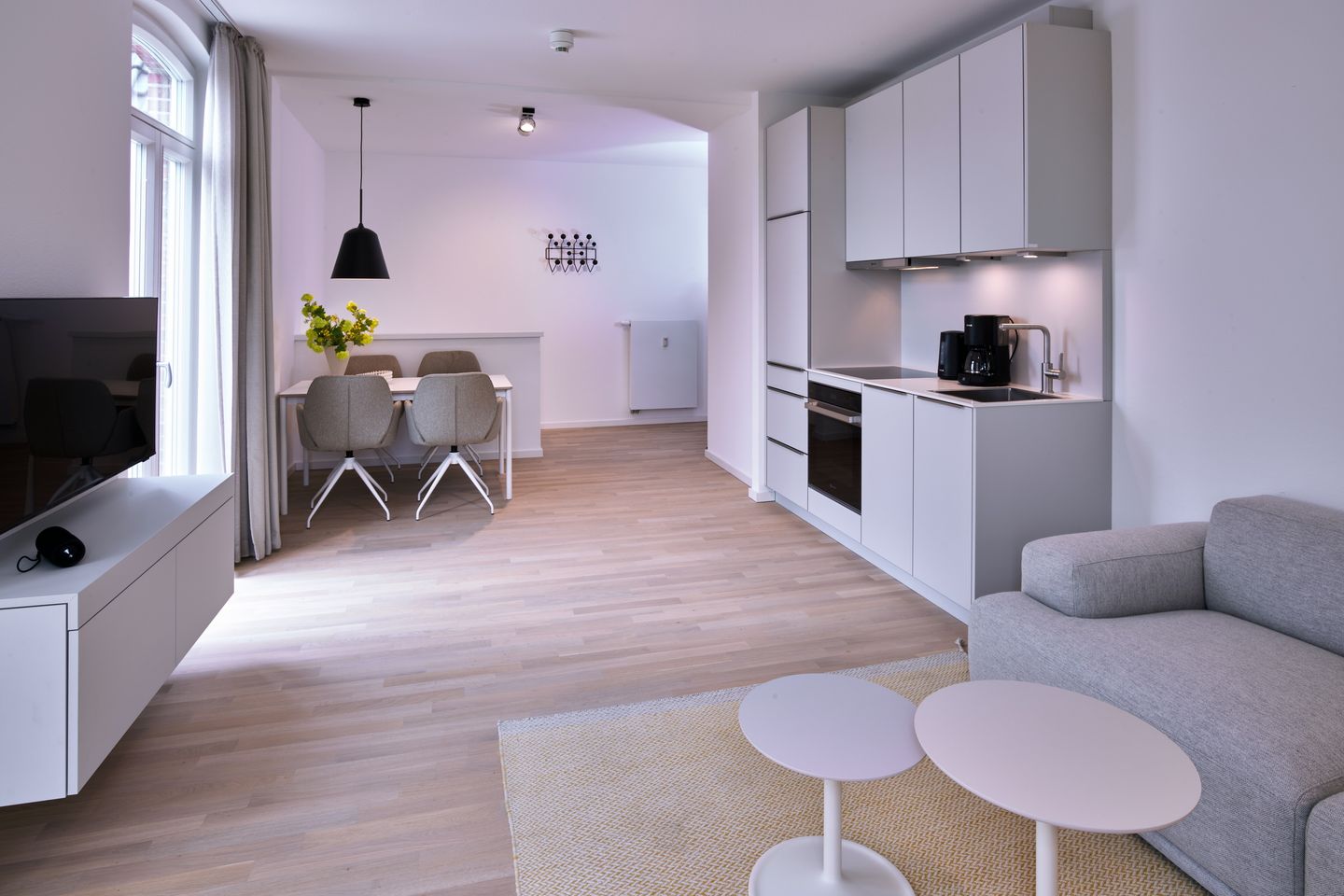 Lüttjeod Apartmentvilla Lüttjeod Apartmentvilla 09 Langeoog - Wohn-Essbereich mit Couch