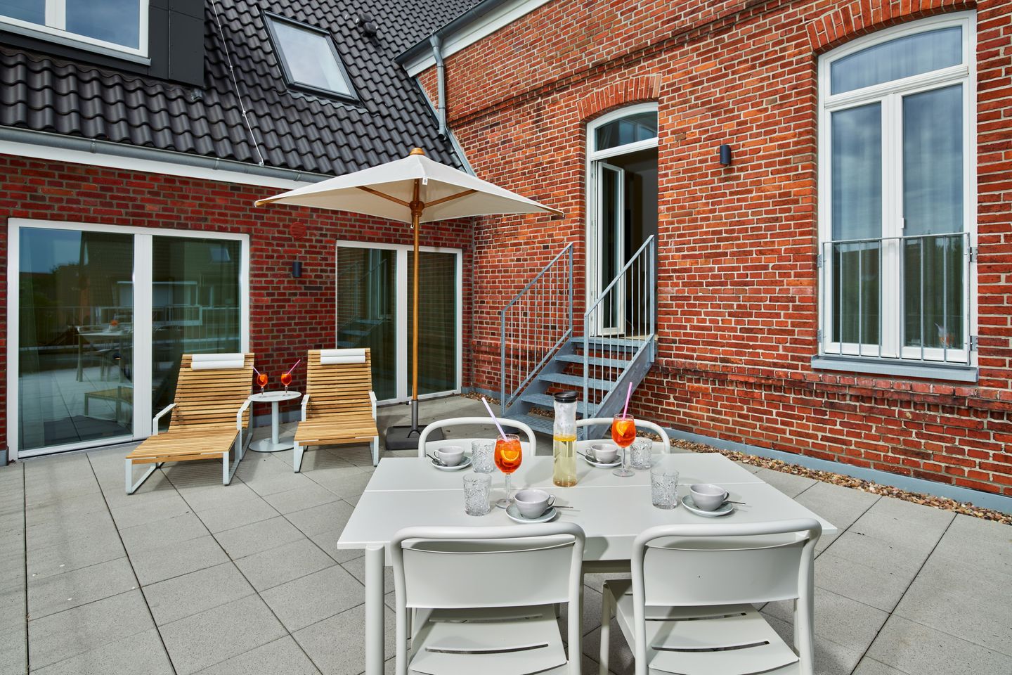 Lüttjeod Apartmentvilla Lüttjeod Apartmentvilla 09 Langeoog - Terrasse mit Gartenmöbeln