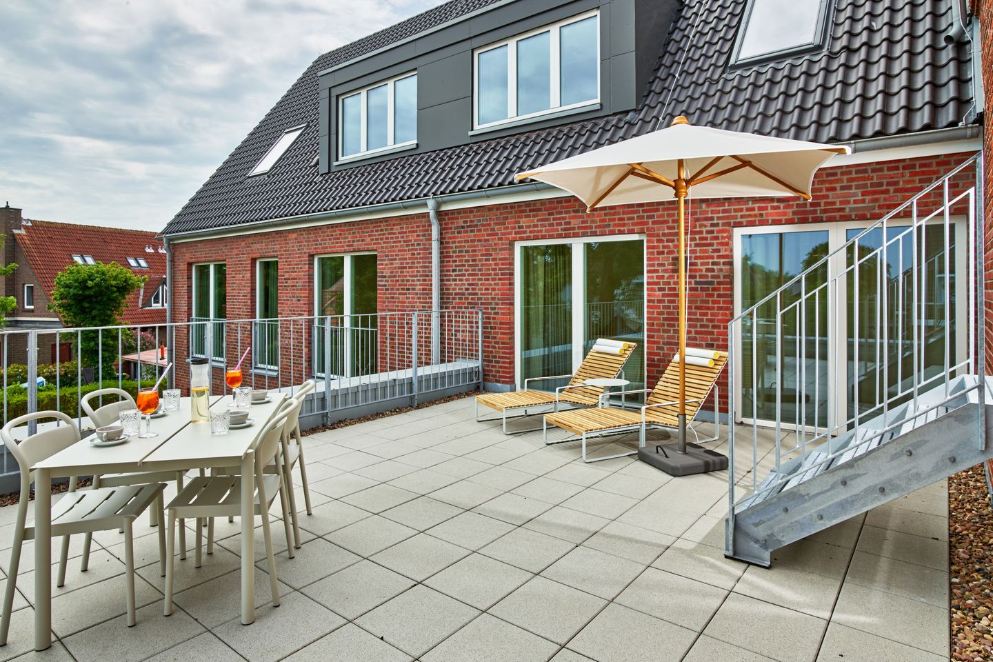 Lüttjeod Apartmentvilla Lüttjeod Apartmentvilla 09 Langeoog - Terrasse mit Gartenmöbeln