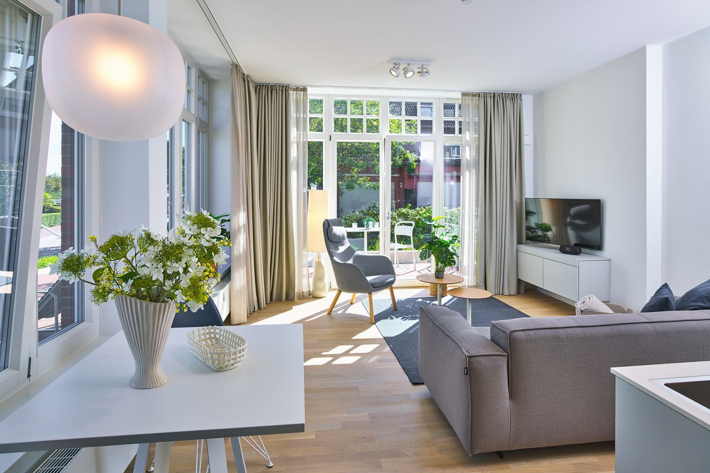 Lüttjeod Apartmentvilla Lüttjeod Apartmentvilla 01 Langeoog - Wohn-Essbereich mit Couch