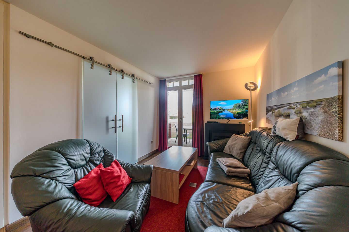 Resort Deichgraf Resort Deichgraf 31-01 Wremen - Wohn-Essbereich mit Couch