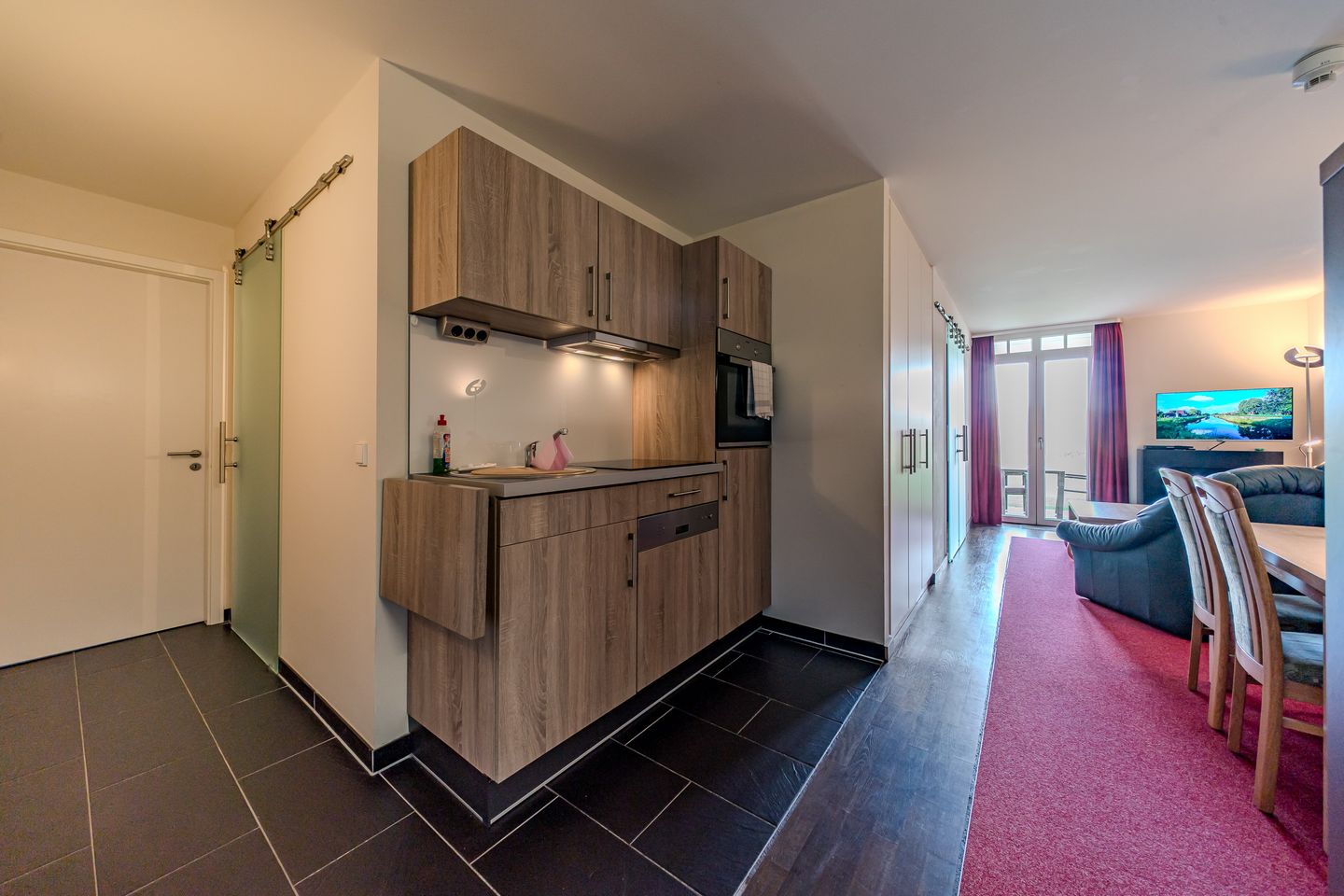 Resort Deichgraf Resort Deichgraf 31-01 Wremen - Wohn-Essbereich mit Küchenzeile