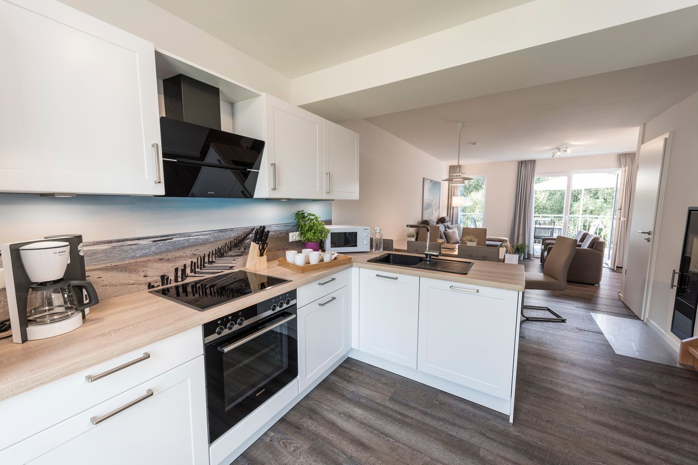 NordseeResort Friesland Ferienhäuser NordseeResort Friesland 38 Schillig - Wohn-Essbereich mit Küchenzeile