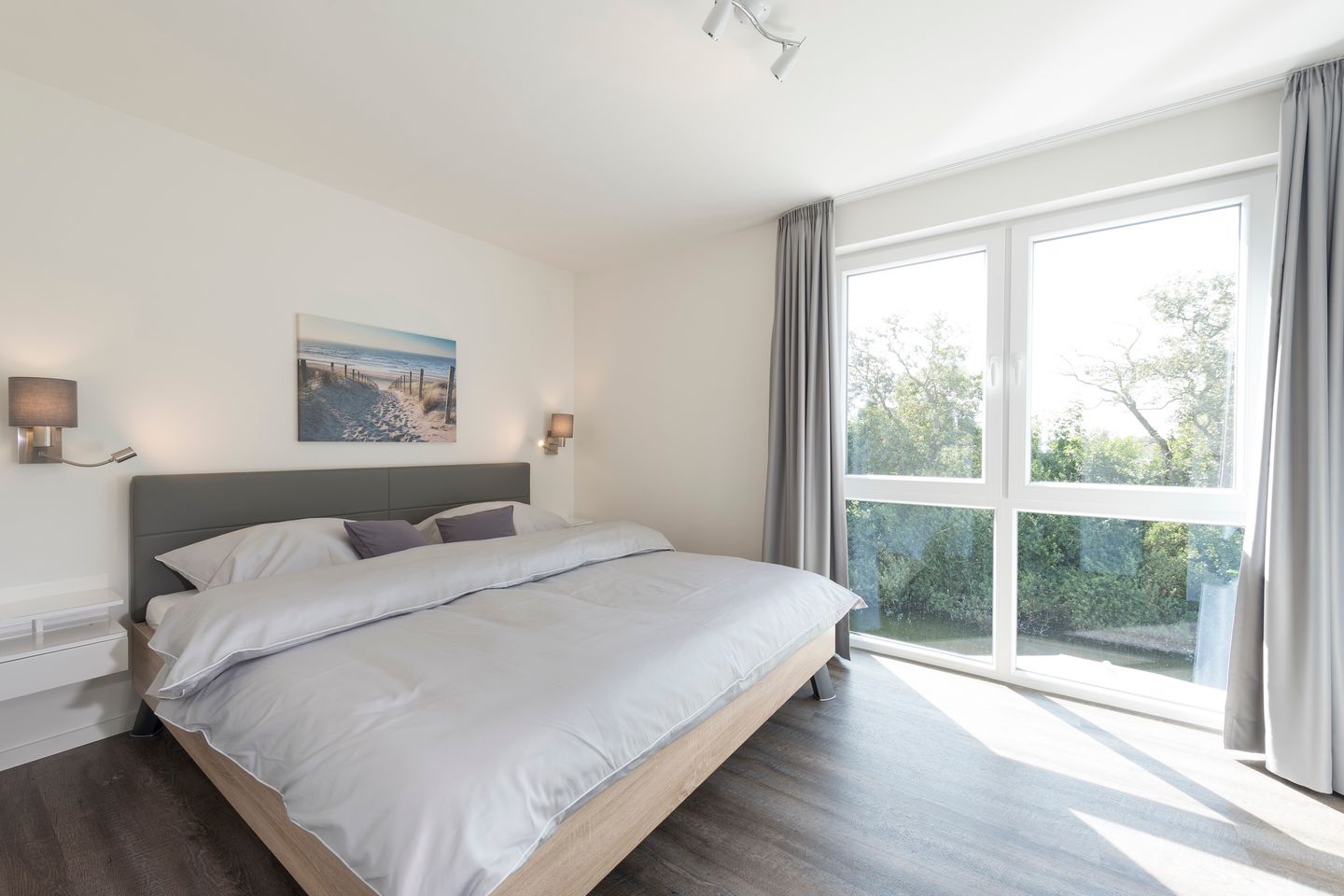 NordseeResort Friesland Ferienhäuser NordseeResort Friesland 38 Schillig - Schlafzimmer mit Doppelbett