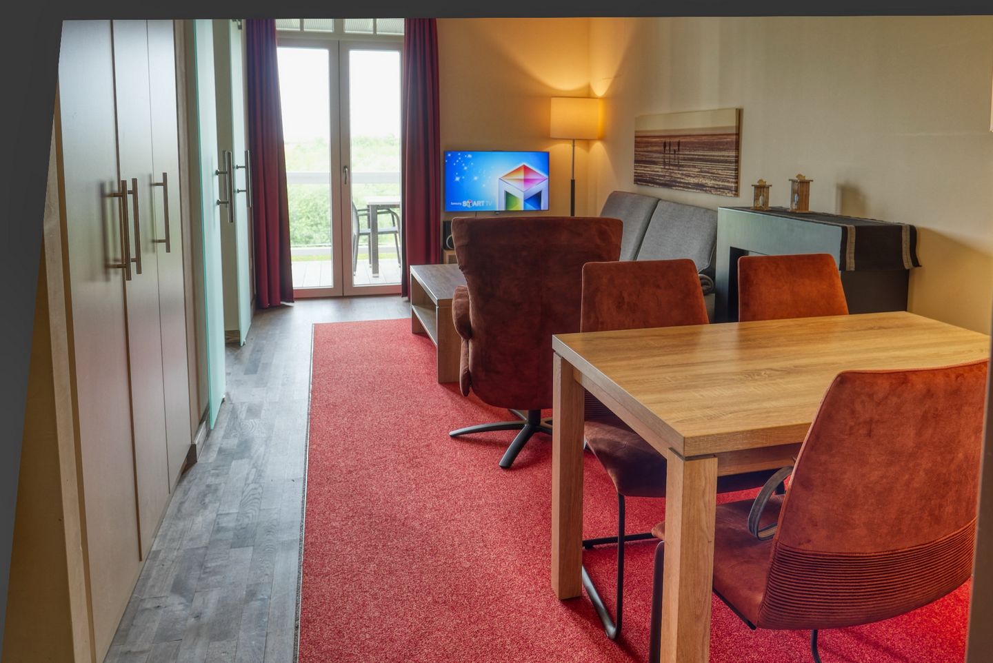 Resort Deichgraf Resort Deichgraf 31-12 Wremen - Wohn-Essbereich mit Couch