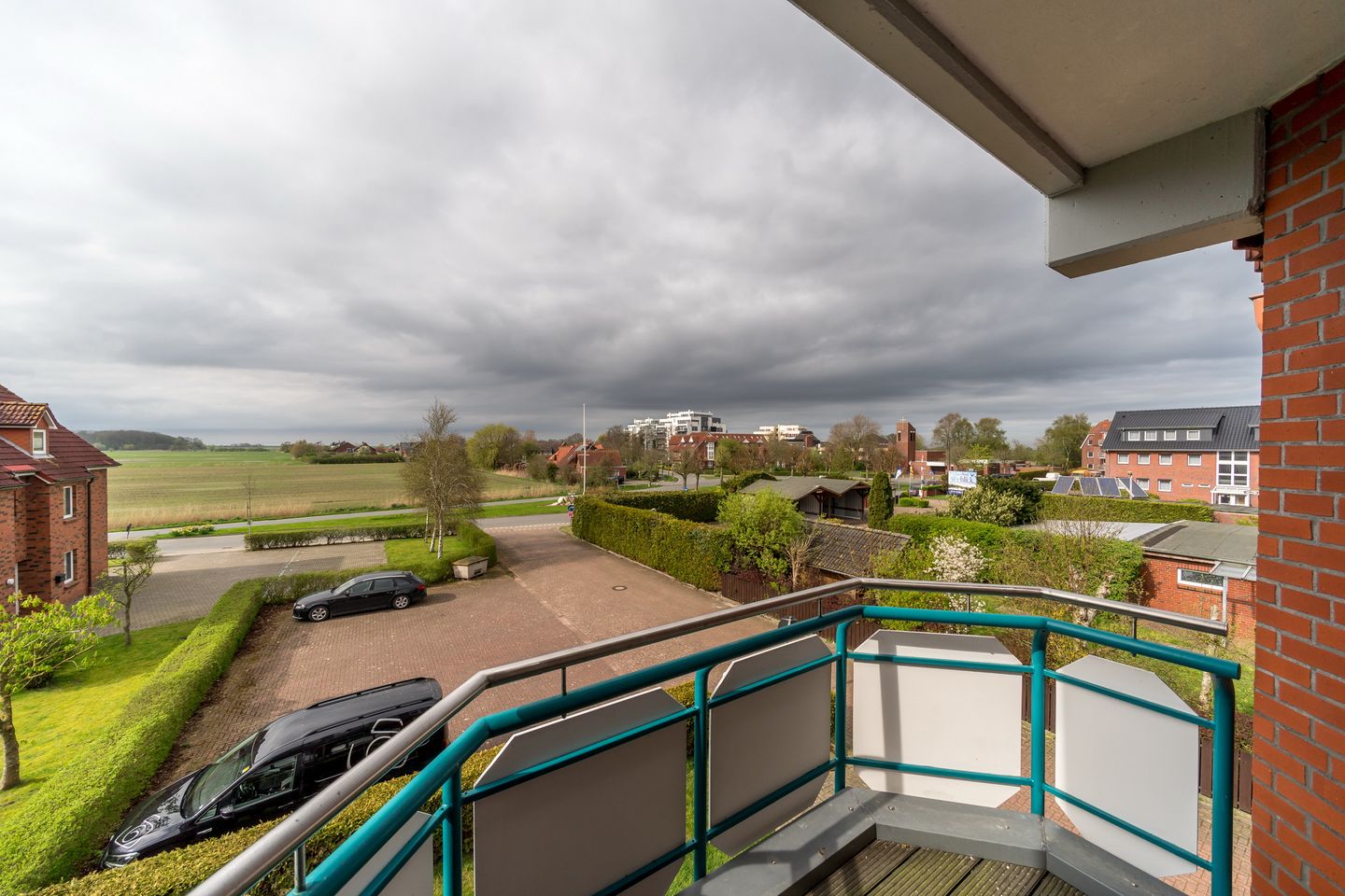 Hus Jadekieker Hus Jadekieker 08 Schillig - Überdachter Balkon mit Sitzgelegenheit