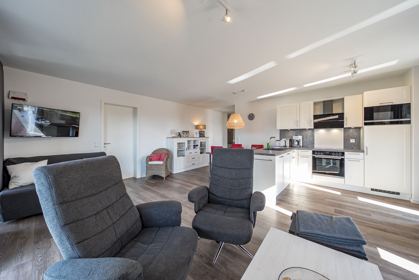 NordseeResort Friesland Nordseeresort Friesland 50-3-s Schillig - Wohn-Essbereich mit Couch