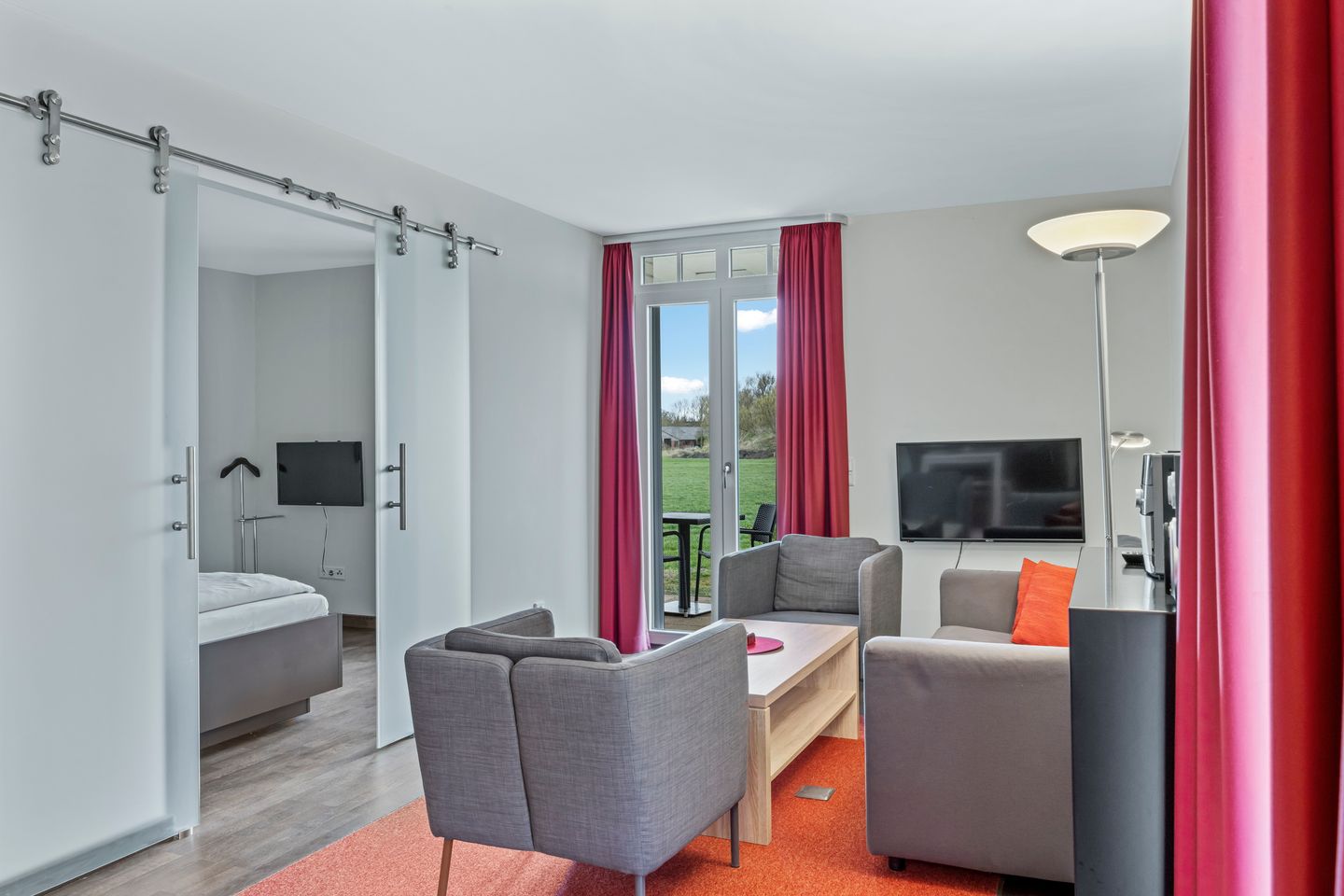 Resort Deichgraf Resort Deichgraf 31-05 Wremen - Wohnbereich mit Zugang zur Terrasse