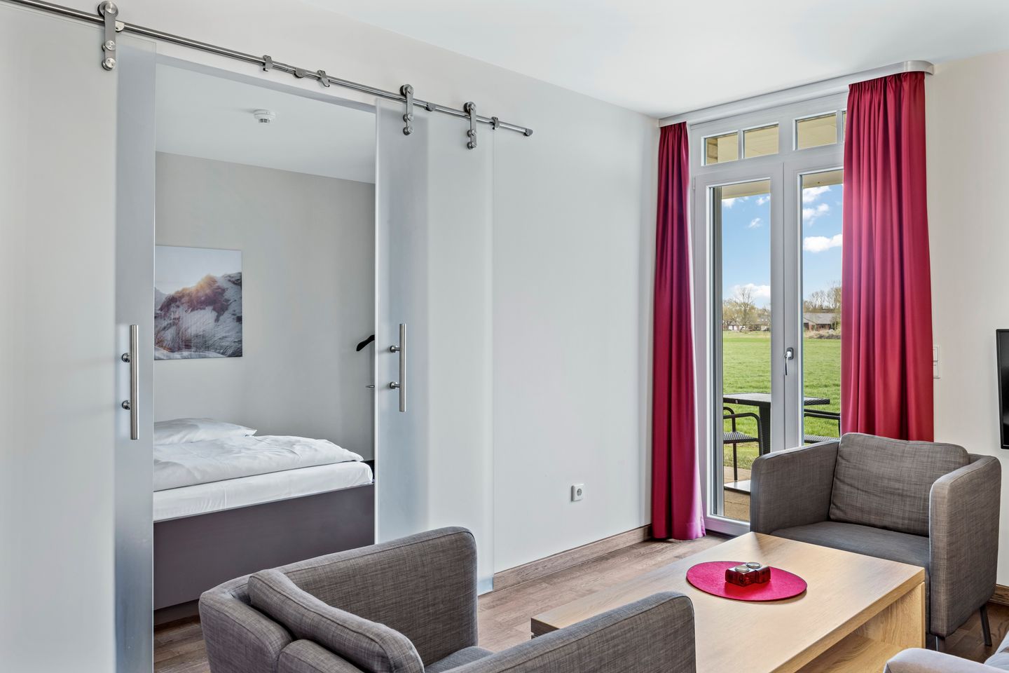 Resort Deichgraf Resort Deichgraf 31-05 Wremen - Wohnbereich mit Zugang zur Terrasse