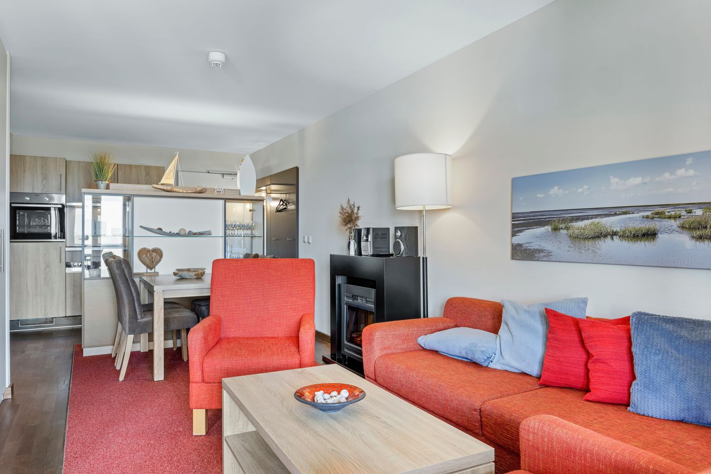 Resort Deichgraf Resort Deichgraf 31-13 Wremen - Wohnbereich mit Küchenzeile und Sitzgelegenheit