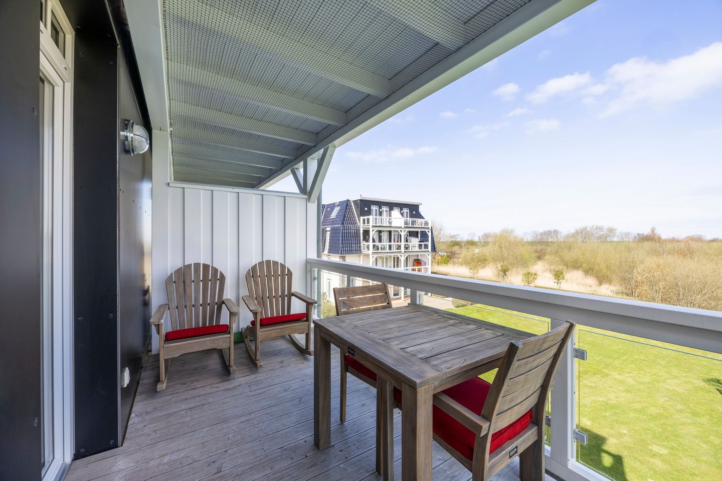 Resort Deichgraf Resort Deichgraf 31-13 Wremen - Balkon mit Gartenmöbel und Ausblick