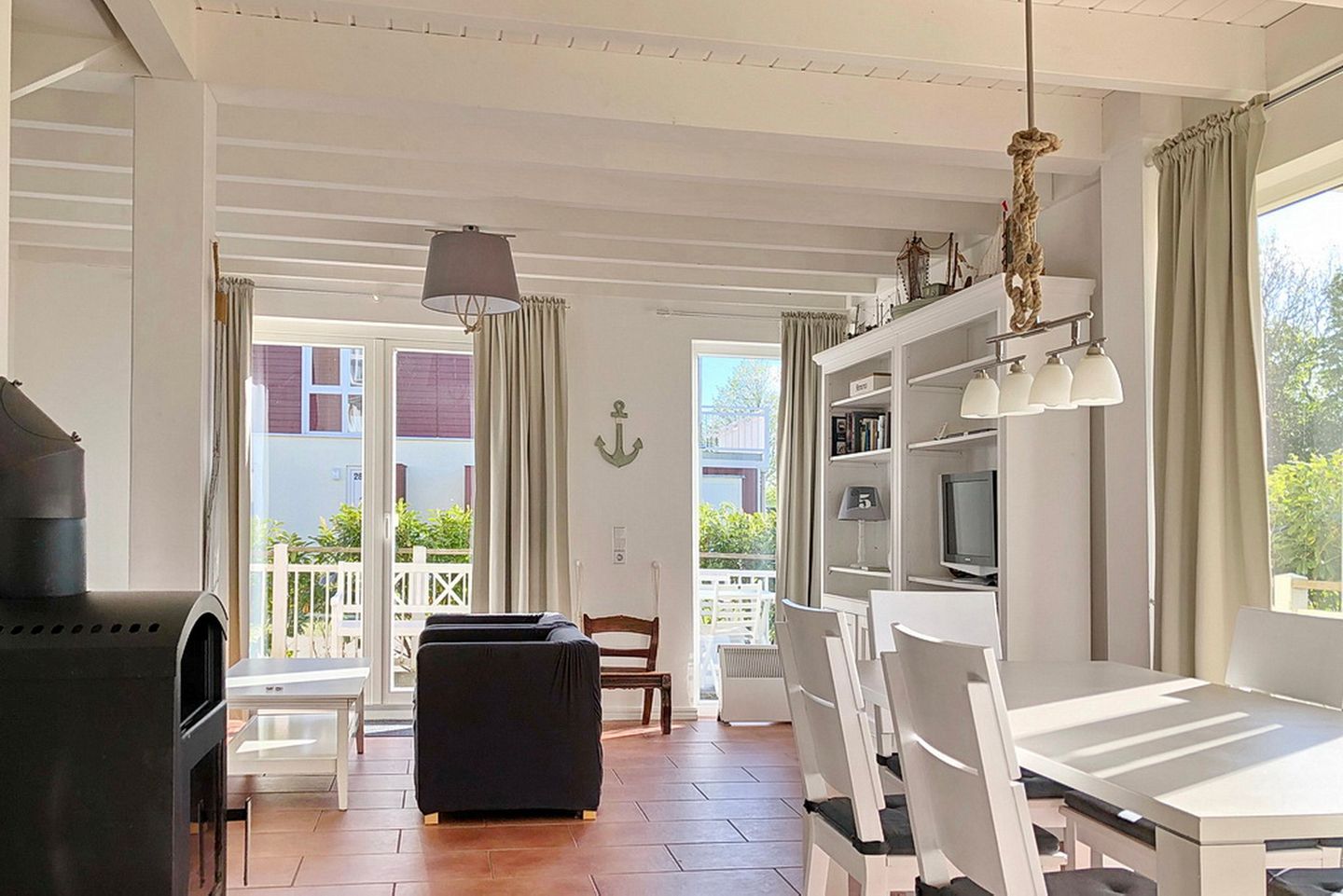 NordseeResort Friesland Ferienhäuser NordseeResort Friesland 1 Schillig - Wohn-Essbereich mit Couch