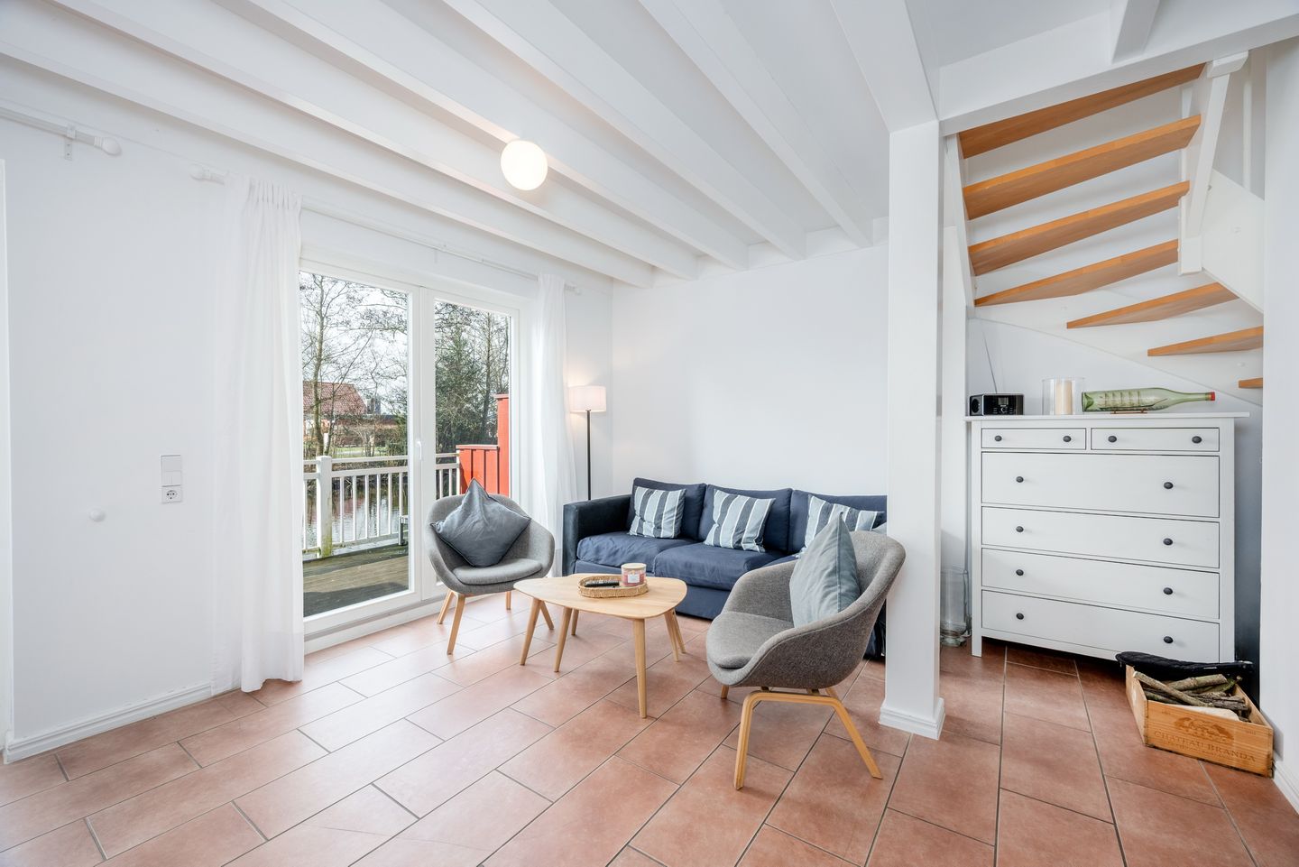 NordseeResort Friesland Ferienhäuser NordseeResort Friesland 30 Schillig - Wohn-Essbereich mit Couch