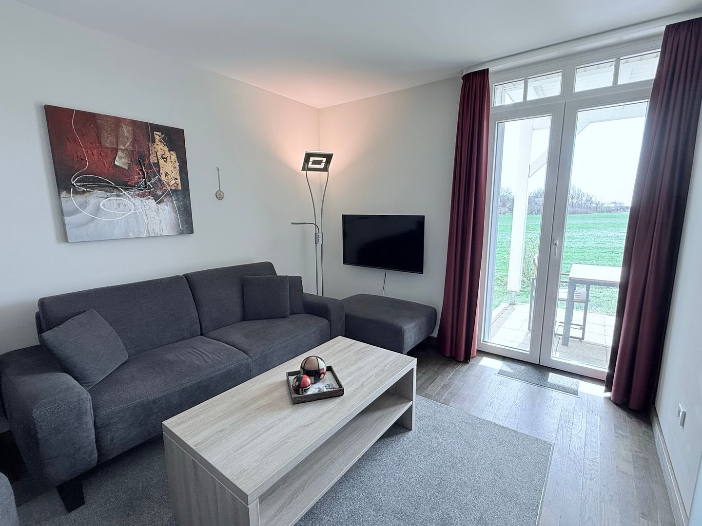 Resort Deichgraf Resort Deichgraf 31-04 Wremen - Wohn-Essbereich mit Couch