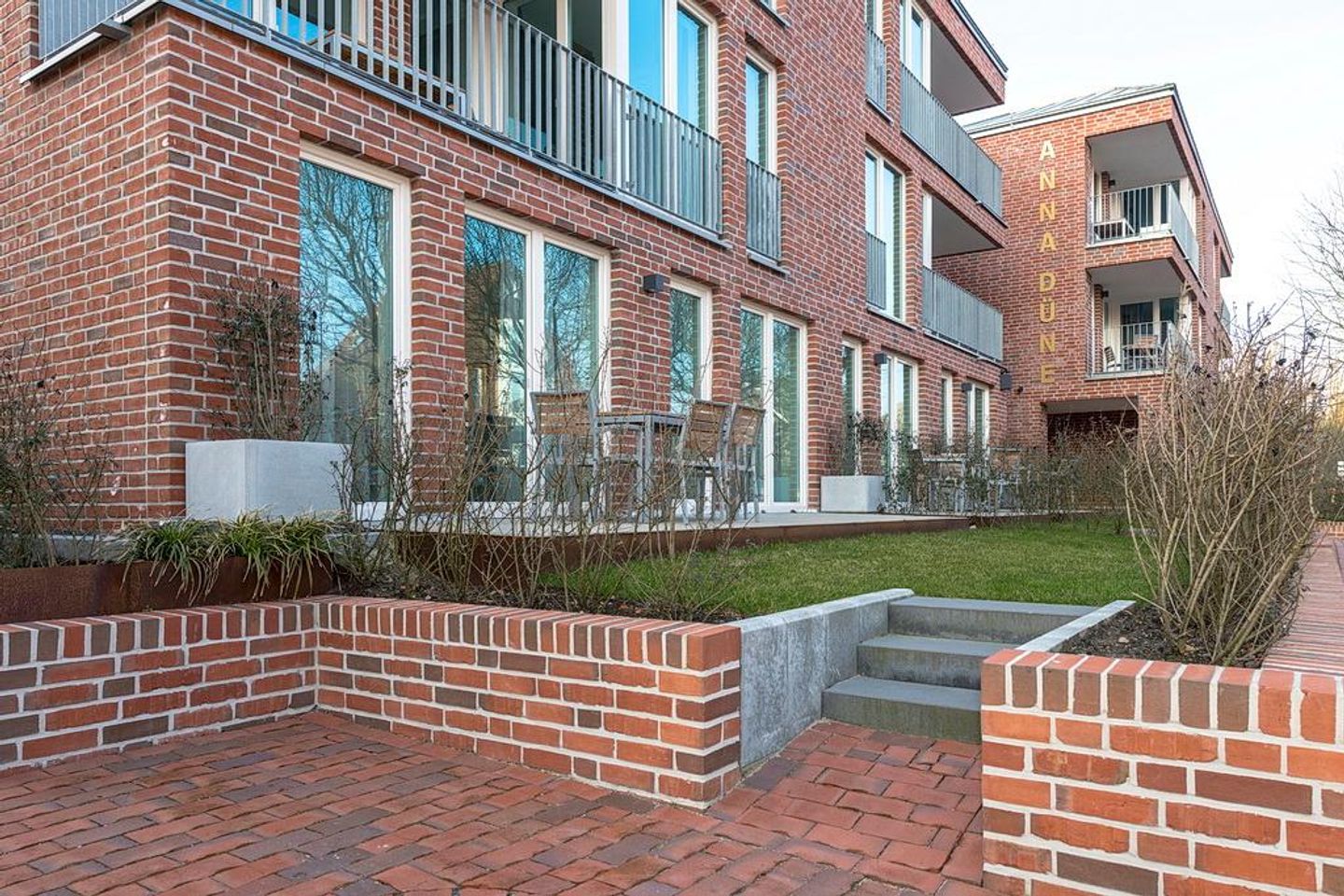 Apartmentvilla Anna See Apartmentvilla Anna See 1-03 Langeoog - Terrasse mit Grünfläche