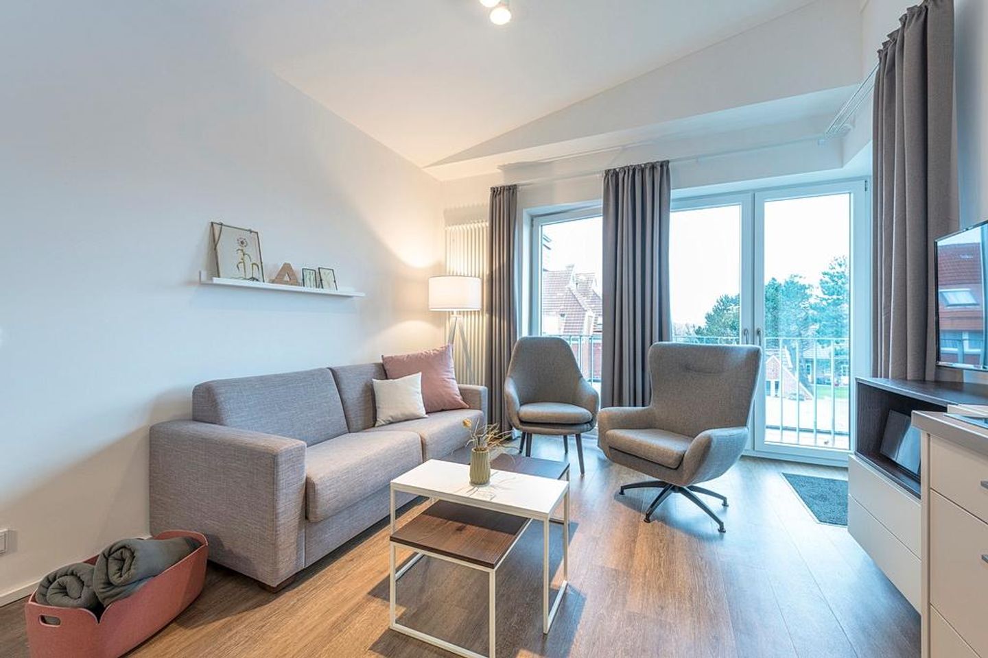 Apartmentvilla Anna See Apartmentvilla Anna See 3-07 Langeoog - Wohnbereich mit Schafsofa