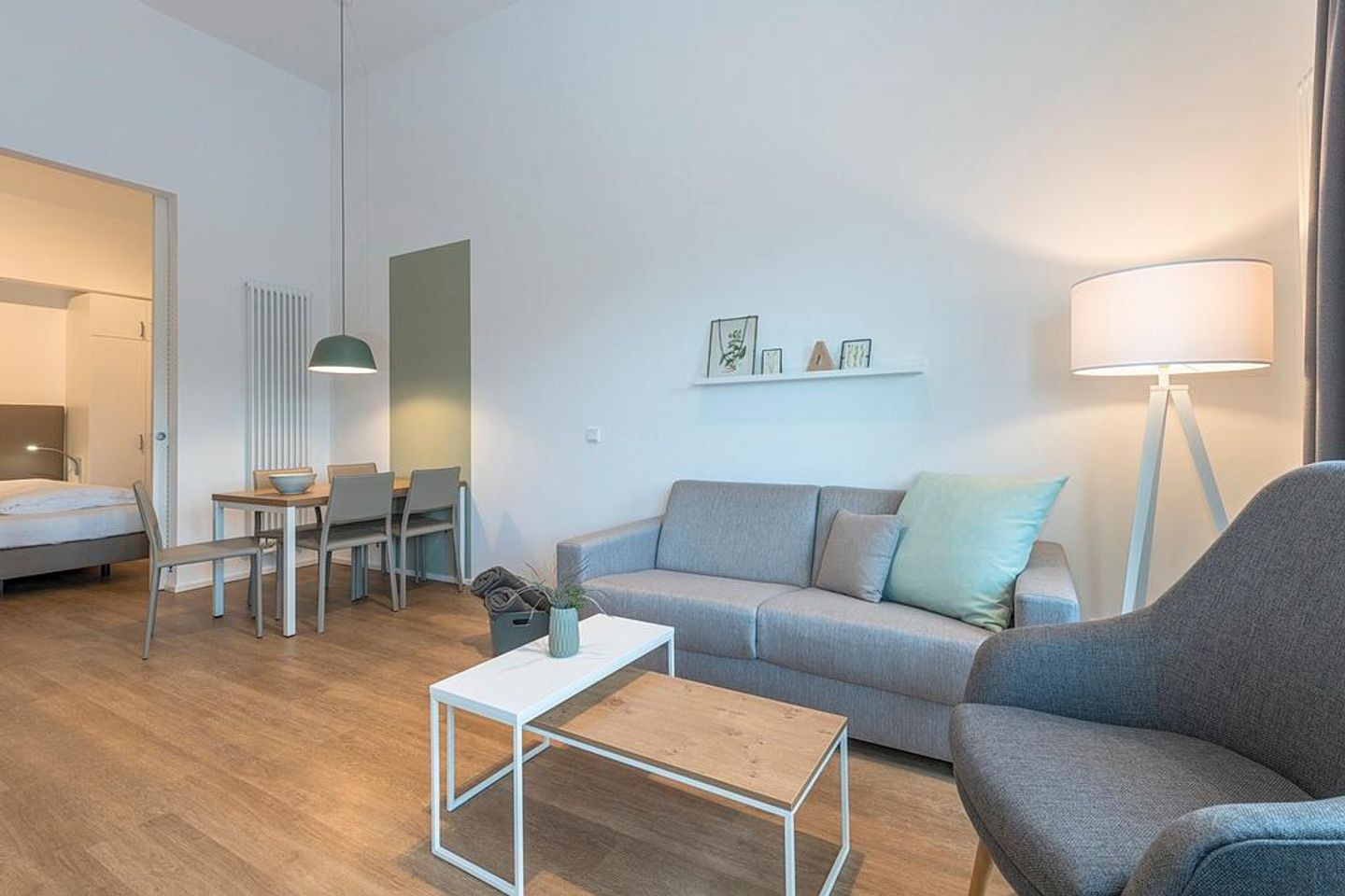 Apartmentvilla Anna See Apartmentvilla Anna See 3-08 Langeoog - Wohnbereich mit Schlafsofa und Esstisch