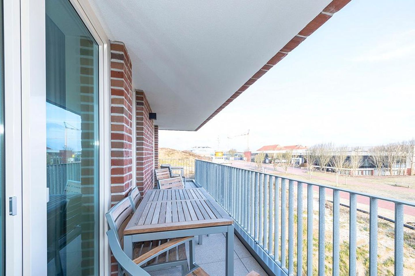 Apartmentvilla Anna See Apartmentvilla Anna See 3-10 Langeoog - Überdachter Balkon mit Sitzgelegenheit