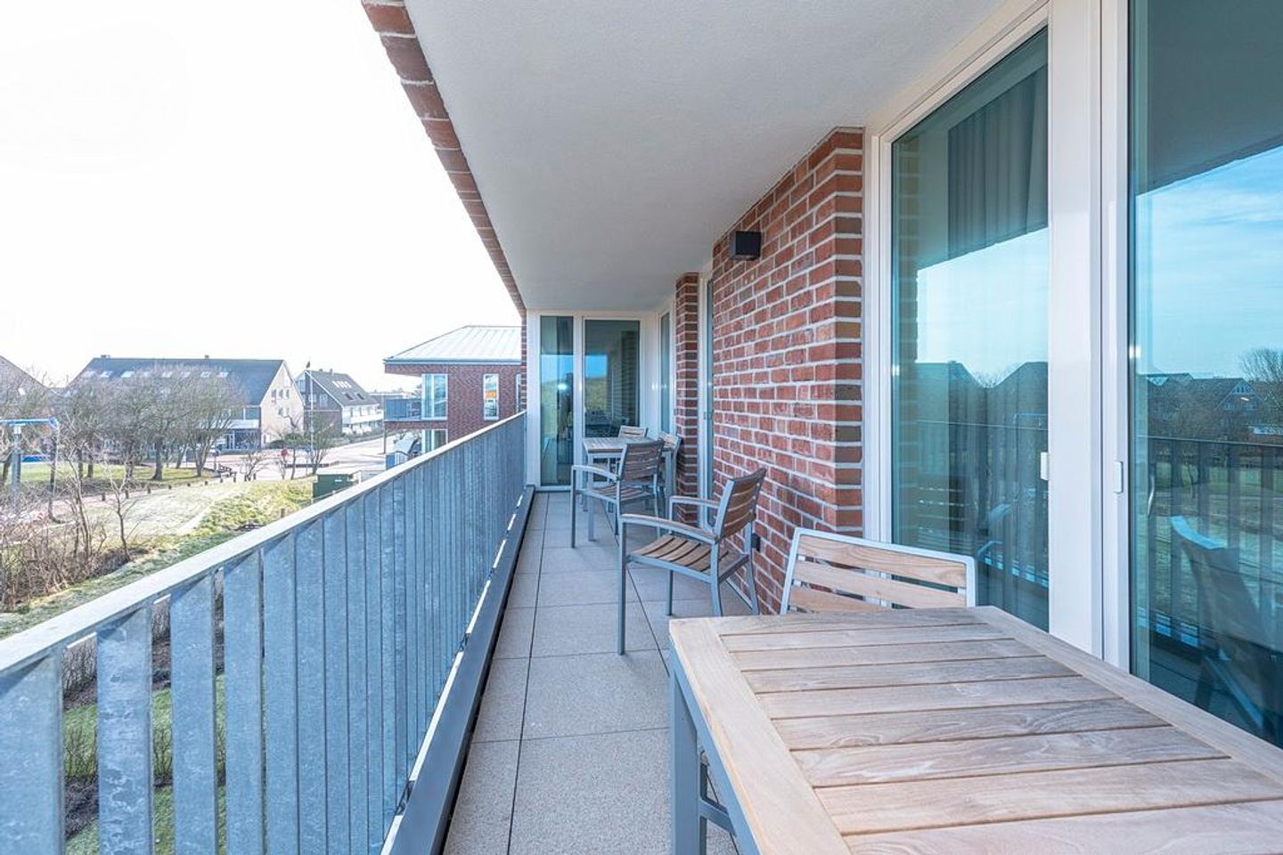 Apartmentvilla Anna See Apartmentvilla Anna See 3-10 Langeoog - Überdachter Balkon mit Sitzgelegenheit