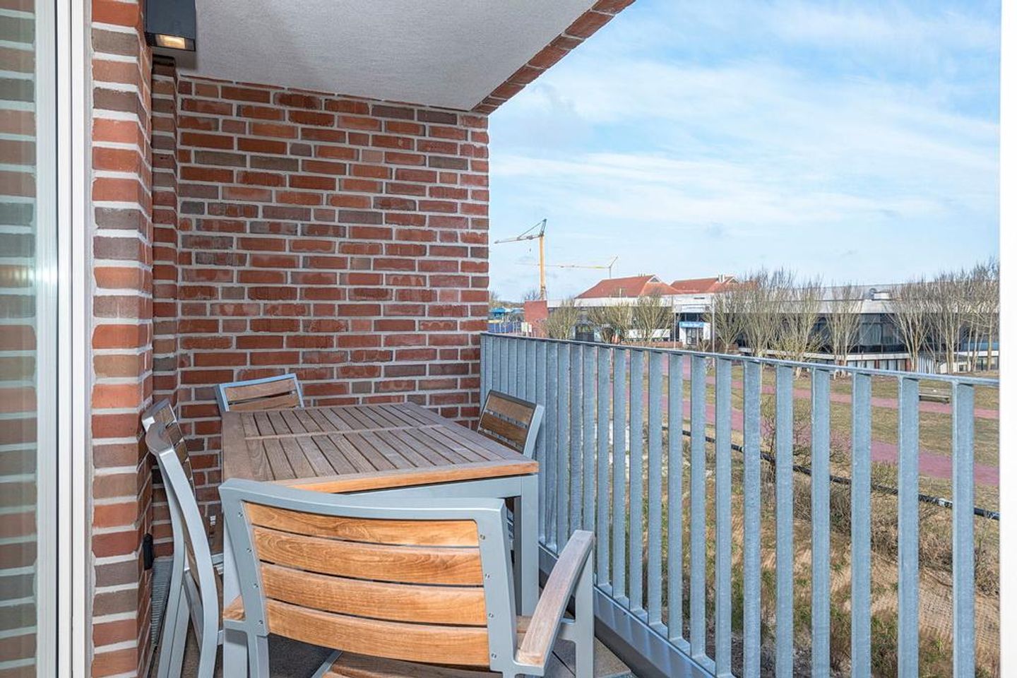 Apartmentvilla Anna See Apartmentvilla Anna See 3-11 Langeoog - Überdachter Balkon mit Sitzgelegenheit