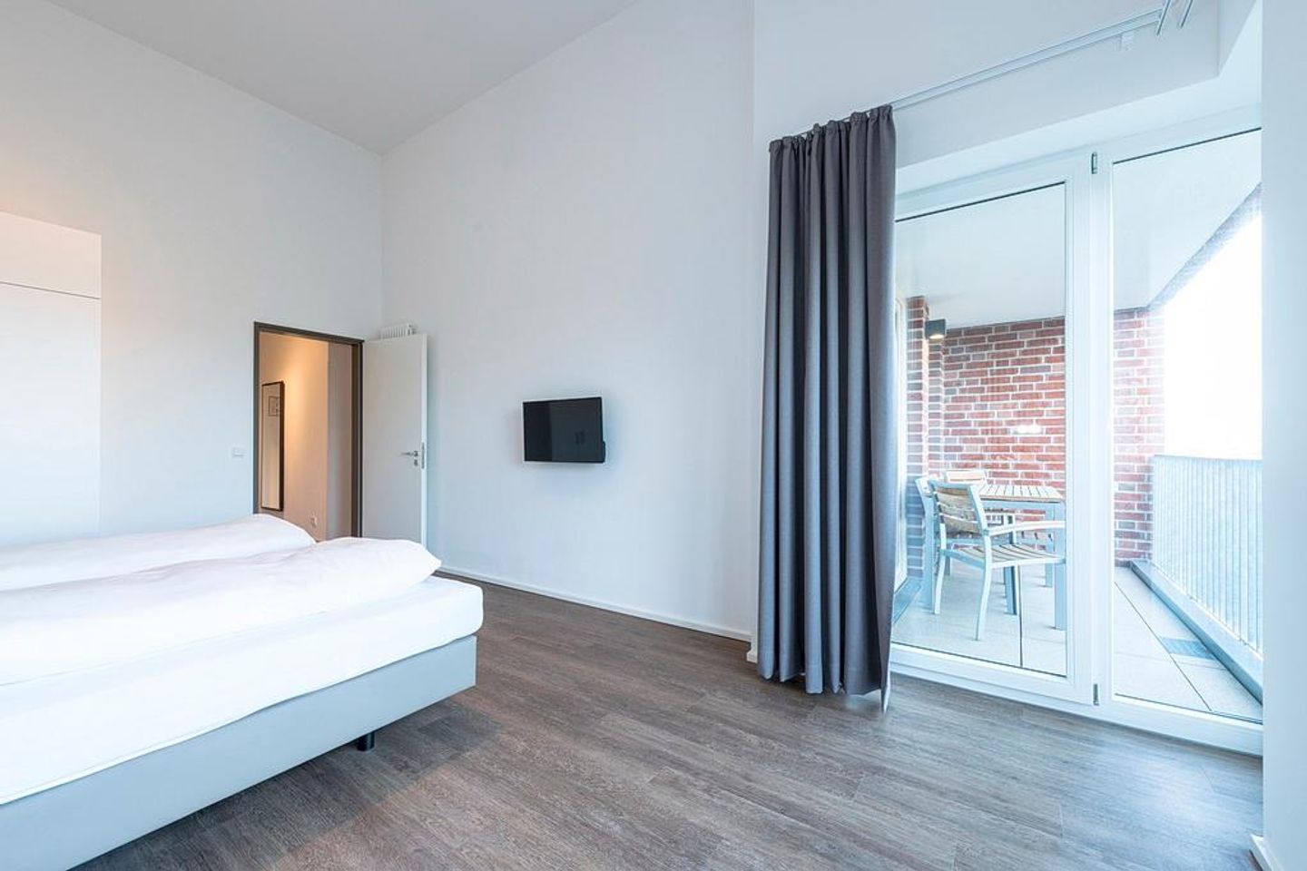 Apartmentvilla Anna See Apartmentvilla Anna See 3-12 Langeoog - Schlafzimmer mit Zugang zum Balkon