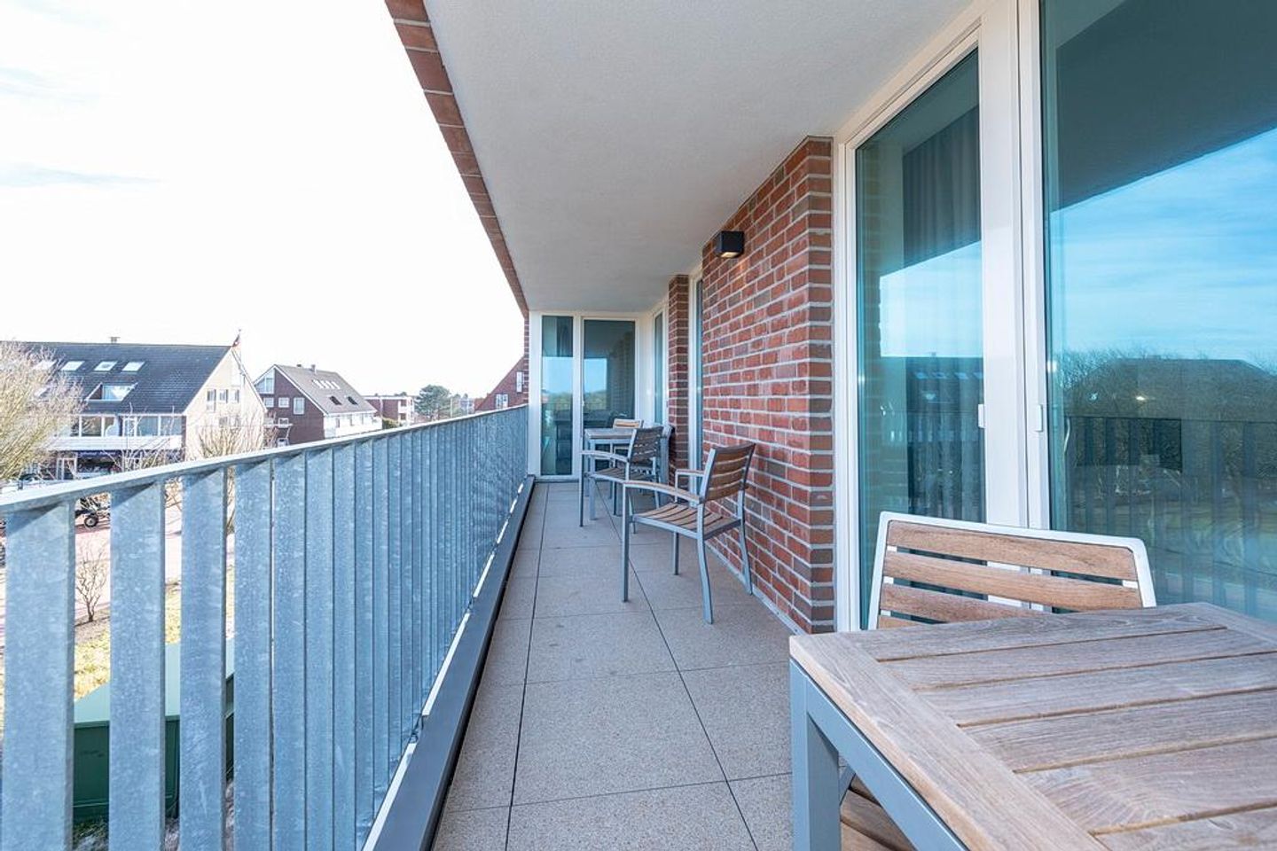 Apartmentvilla Anna See Apartmentvilla Anna See 3-13 Langeoog - Überdachter Balkon mit Sitzgelegenheit