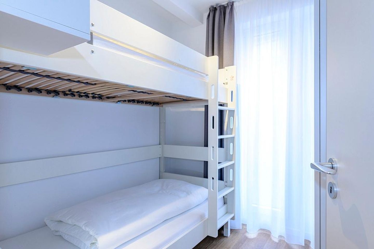 Deichhäuser Anna Küste Deichhäuser Anna Küste 1-10 Bensersiel - Schlafzimmer mit Stapelbett