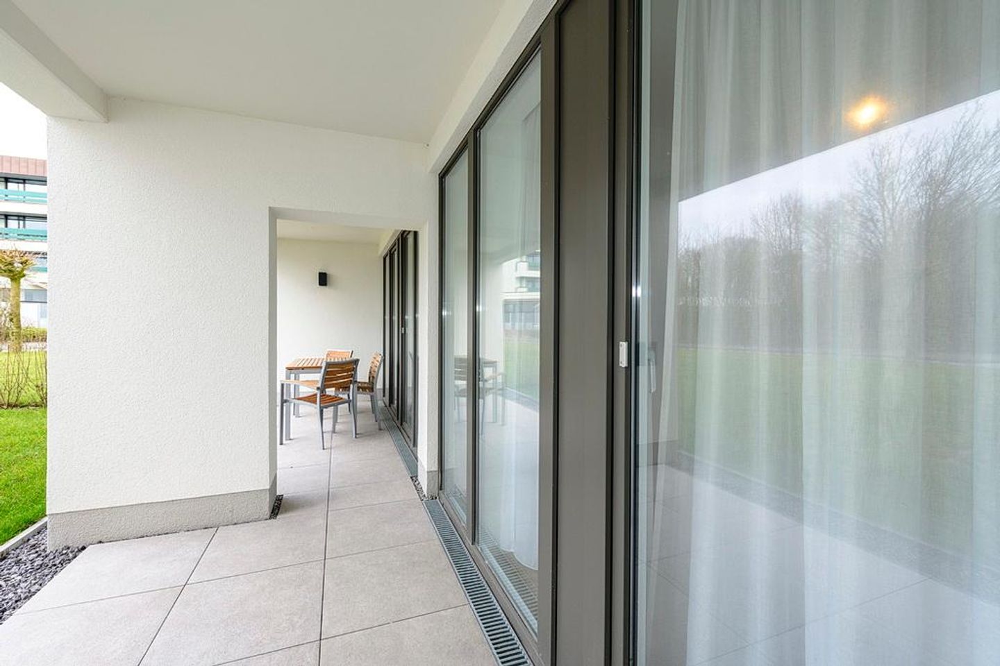 Deichhäuser Anna Küste Deichhäuser Anna Küste 1-13 Bensersiel - Terrasse mit Garten und Sitzgelegenheiten